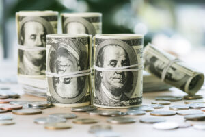 selective focus of dollar banknotes in rolls with rubber bands a